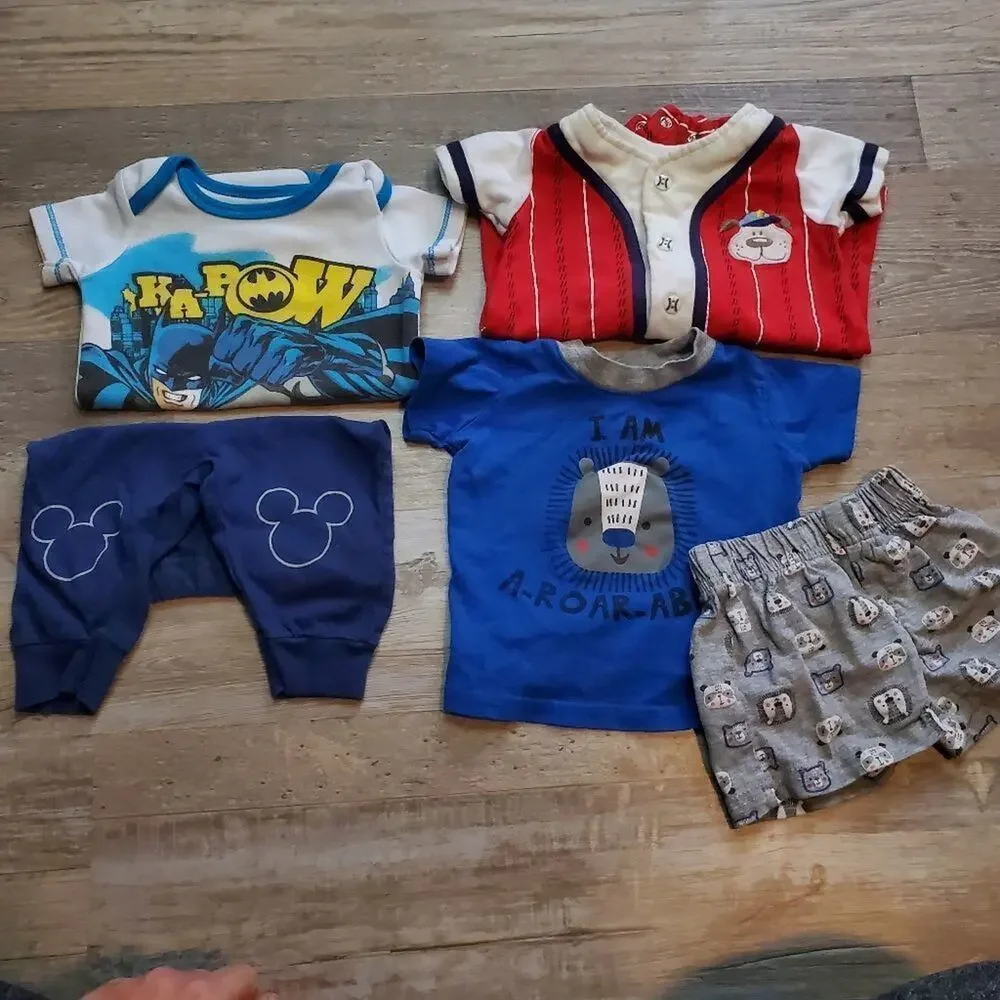 Assorted 0-3 month onesies and matching sets